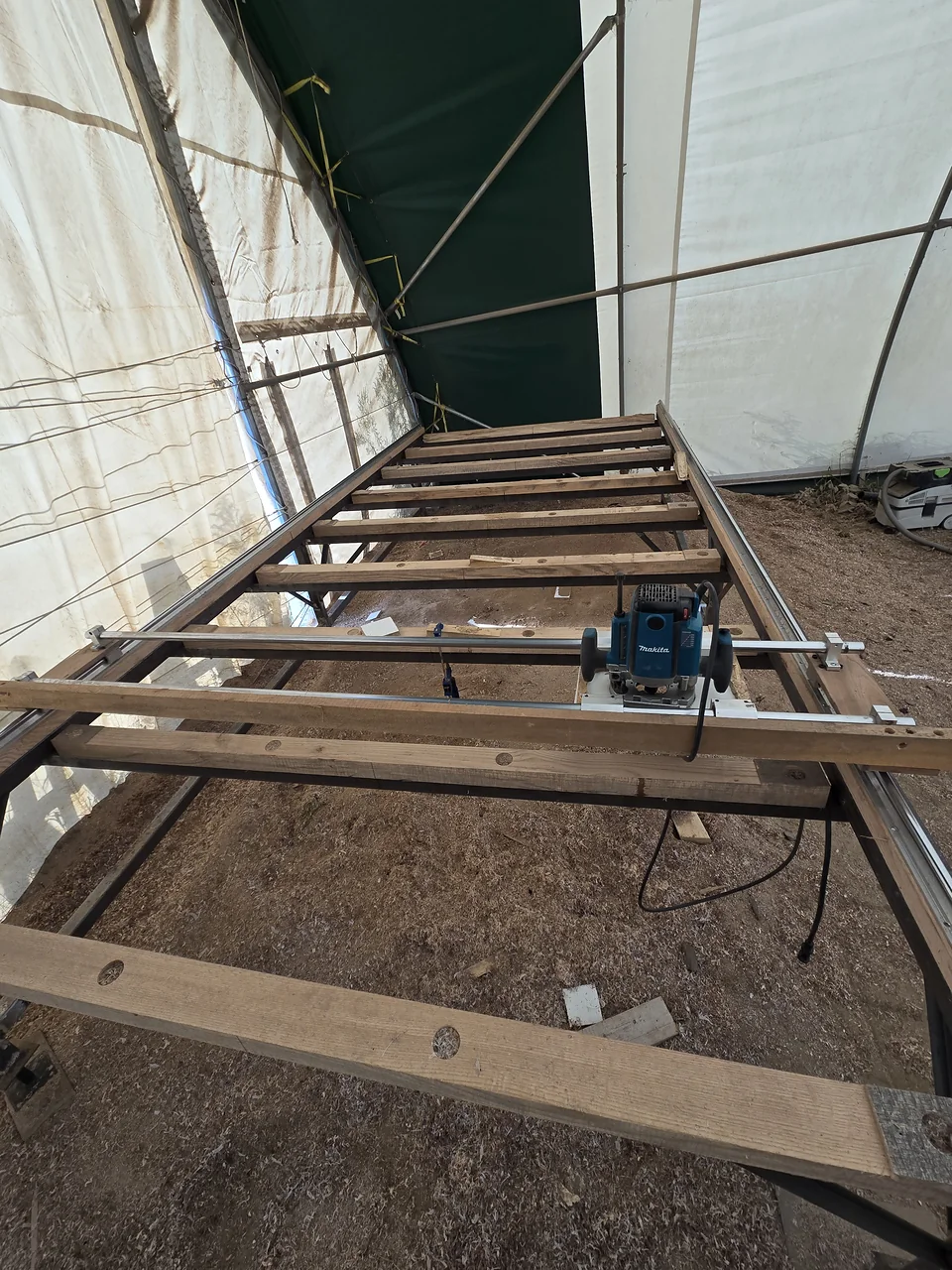 The custom router sled used to flatten wide slabs